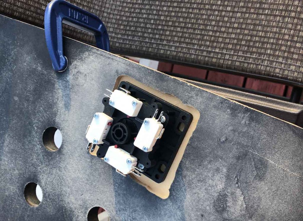 The joystick mounting assembly in the routed area